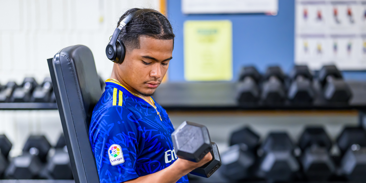 Student weightlifting in Bristol's fitness center