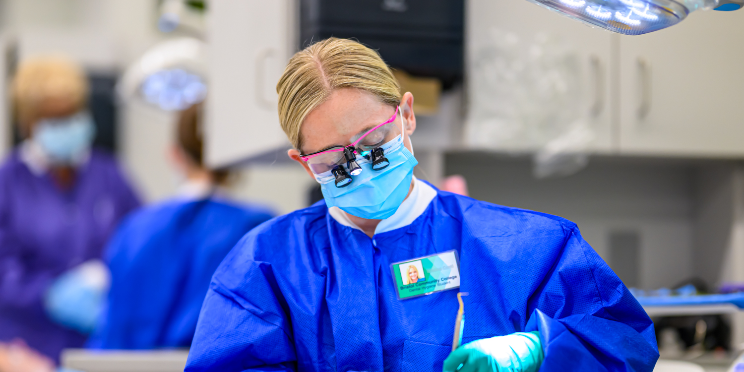 Dental hygiene student performing a cleaning