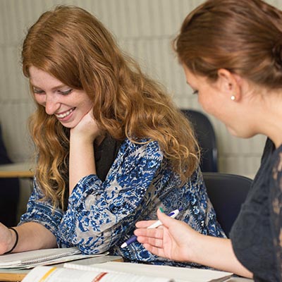 two women doing schoolwork together