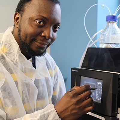 Man working with technology in science lab