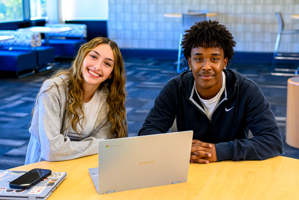 Students at a laptop together