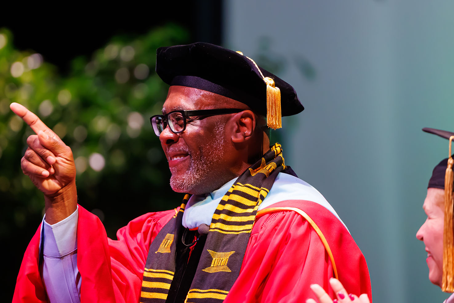 Dr. Harris and pointing on stage at Inauguration