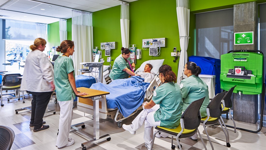 Nursing students working on a patient dummy