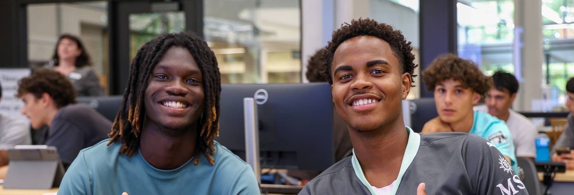 Two Bristol students together in the library