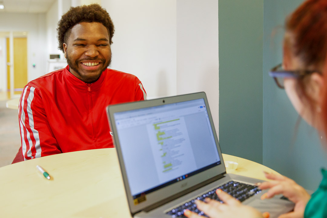 Student working with a mentor