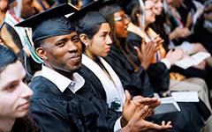 graduates with diplomas