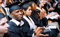 graduates with diplomas