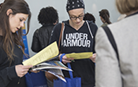 group of students reviewing papers