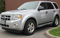 silver suv with the college logo on the front door