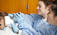 picture of students practicing health care skille