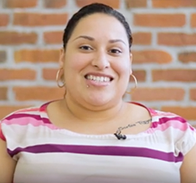 person with pink striped shirt, brown hair and brown eyes