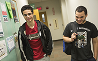 two students walking down hallway