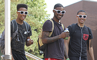 Three male students standing