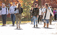 students walking outside during autumn