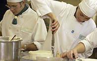 baking student frosting a cake
