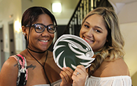 two female students smiling