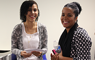 two people smiling at camera