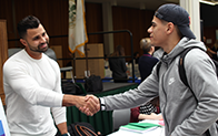 two students shaking hands