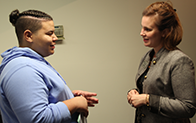 student and teacher talking