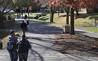 students walking outside on an autumn day