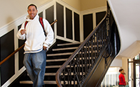 student walking down staircase