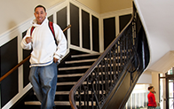 student waling down stairs