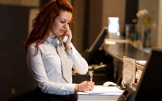 hotel receptionist on phone