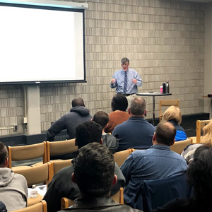 person lecturing at a forum