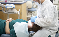 dental hygienist cleaning teeth