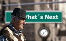 man standing in front of a clock