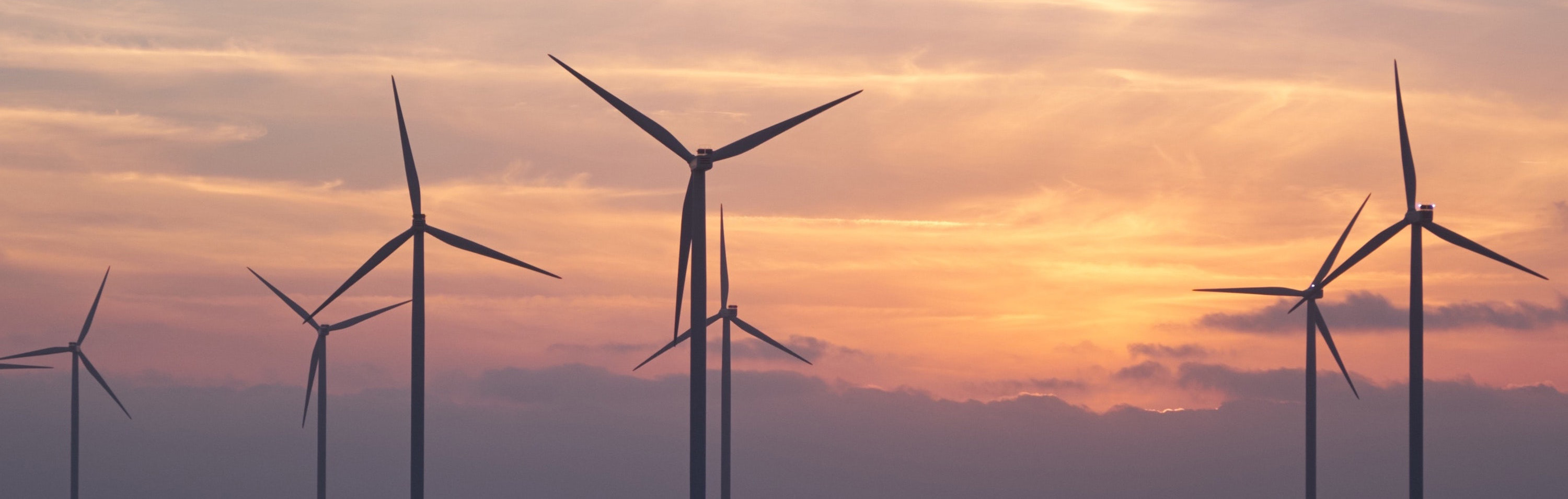 wind turbines at sunset